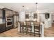 Modern kitchen featuring stainless steel appliances and a breakfast bar at 3034 Raddercrest Ct, Fuquay Varina, NC 27526