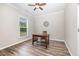 Office with a wooden table and wood-look flooring gets great natural light at 3034 Raddercrest Ct, Fuquay Varina, NC 27526