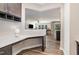 Bright office area with white countertops, dark cabinets, and wood flooring overlooking the living room at 3034 Raddercrest Ct, Fuquay Varina, NC 27526