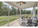 Comfortable screened porch with nice patio furniture has a view of the backyard at 3034 Raddercrest Ct, Fuquay Varina, NC 27526