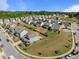 Neighborhood aerial view highlighting homes with fenced backyards, and well-manicured lawns at 325 Avery Glenn Way, Fuquay Varina, NC 27526
