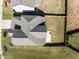 Aerial shot showcasing the backyard, modern fire pit, and patio nestled within a secure, fenced perimeter at 325 Avery Glenn Way, Fuquay Varina, NC 27526