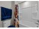 Bathroom features shower/tub and colorful shower curtain at 325 Avery Glenn Way, Fuquay Varina, NC 27526
