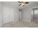 Neutral bedroom features double door closet and additional hallway at 325 Avery Glenn Way, Fuquay Varina, NC 27526