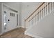 Bright entryway featuring wood-look flooring and staircase at 325 Avery Glenn Way, Fuquay Varina, NC 27526