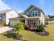 Exterior view of a two-story home with landscaped yard at 325 Avery Glenn Way, Fuquay Varina, NC 27526