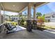 Inviting front porch with stone pillar bases, seating, and landscaping at 325 Avery Glenn Way, Fuquay Varina, NC 27526