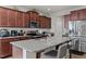 Spacious kitchen with granite countertops, stainless steel appliances, and island seating, great for cooking and entertaining at 325 Avery Glenn Way, Fuquay Varina, NC 27526