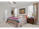 Bright and airy primary bedroom with a ceiling fan, and bedside tables on either side of the bed at 325 Avery Glenn Way, Fuquay Varina, NC 27526