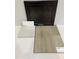 Interior finish selections featuring dark wood cabinets, light quartz countertop, and soft beige flooring at 360 Chesapeak Commons St # 134, Garner, NC 27529