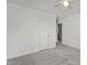 Carpeted bedroom with ceiling fan, white door, and neutral walls at 3816 Mike Levi Ct, Raleigh, NC 27610