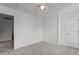 Carpeted room featuring light, neutral walls and bathroom access at 3816 Mike Levi Ct, Raleigh, NC 27610