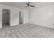 Spacious bedroom with neutral carpet, fan and two closets at 3816 Mike Levi Ct, Raleigh, NC 27610