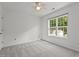 Carpeted bedroom featuring light walls and a window with a yard view at 3816 Mike Levi Ct, Raleigh, NC 27610