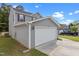 Side view of a gray home with an attached garage at 3816 Mike Levi Ct, Raleigh, NC 27610