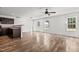 Inviting living space with durable hardwood floors, a ceiling fan, and lots of natural light at 3816 Mike Levi Ct, Raleigh, NC 27610