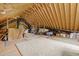 Spacious unfinished attic featuring exposed rafters with room for storage and customization at 3913 Orchard Point Ct, Apex, NC 27539