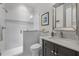 Bathroom featuring glass shower and dark vanity with marble countertop at 3913 Orchard Point Ct, Apex, NC 27539
