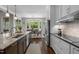 Modern kitchen featuring stainless steel appliances, an island with bar seating, and lots of natural light at 3913 Orchard Point Ct, Apex, NC 27539
