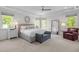 Bright and airy primary bedroom with neutral color palette at 3913 Orchard Point Ct, Apex, NC 27539