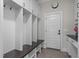 Mudroom with storage lockers, bench, and convenient hooks at 3913 Orchard Point Ct, Apex, NC 27539