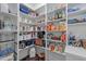 Well-organized pantry with shelving from floor to ceiling at 3913 Orchard Point Ct, Apex, NC 27539