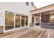 Exterior of a home featuring a wooden deck, screened in porch with stone fireplace and wooded views at 4009 Yates Mill Pond Rd, Raleigh, NC 27606