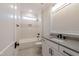 Stylish bathroom featuring modern vanity and tub with tile surround at 4009 Yates Mill Pond Rd, Raleigh, NC 27606