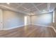 Bedroom with coffered ceiling, wood floors, and recessed lighting at 4009 Yates Mill Pond Rd, Raleigh, NC 27606