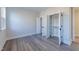 Bedroom with closet featuring built-in shelving and ample storage space at 4009 Yates Mill Pond Rd, Raleigh, NC 27606
