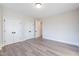 Bedroom featuring wood floors and closet doors at 4009 Yates Mill Pond Rd, Raleigh, NC 27606