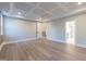 Spacious bedroom with tray ceiling, ceiling fan, and hardwood floors at 4009 Yates Mill Pond Rd, Raleigh, NC 27606