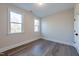 Bright bedroom features natural lighting and wood-look flooring at 4009 Yates Mill Pond Rd, Raleigh, NC 27606