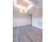 Dining room with chandelier, decorative molding and hardwood floors at 4009 Yates Mill Pond Rd, Raleigh, NC 27606