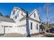Stunning three-car garage and white siding showcase this beautiful home's exterior at 4009 Yates Mill Pond Rd, Raleigh, NC 27606