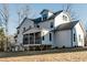 Spacious backyard featuring a screened porch and a white home exterior at 4009 Yates Mill Pond Rd, Raleigh, NC 27606