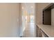 Hallway with doorway access to living area featuring built-in storage space at 4009 Yates Mill Pond Rd, Raleigh, NC 27606
