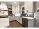 Stylish kitchen features sleek stainless steel appliances, custom white cabinetry, and modern countertops at 4009 Yates Mill Pond Rd, Raleigh, NC 27606