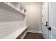 Well-organized mudroom features a bench, storage cubbies, and modern white shiplap for efficient living at 4009 Yates Mill Pond Rd, Raleigh, NC 27606