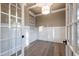 Bright office with built-in bookshelves, hardwood floors, and recessed lighting at 4009 Yates Mill Pond Rd, Raleigh, NC 27606