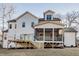 Expansive backyard featuring a screened porch and a wooden deck at 4009 Yates Mill Pond Rd, Raleigh, NC 27606