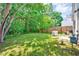 Large backyard with green lawn and privacy fence, providing a serene outdoor space at 4114 Sudbury Rd, Durham, NC 27704