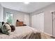 Inviting bedroom featuring soft pillows, natural light, and closet space at 4114 Sudbury Rd, Durham, NC 27704