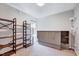 Bedroom featuring a murphy bed, shelving, and neutral carpeting at 4114 Sudbury Rd, Durham, NC 27704