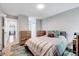 Comfortable bedroom with a soft bed, natural light, and stylish accent furniture at 4114 Sudbury Rd, Durham, NC 27704