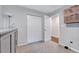 Carpeted bedroom with closet, overhead lighting, and dresser at 4114 Sudbury Rd, Durham, NC 27704