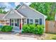 A lovely one-story home exhibits great curb appeal with its manicured lawn and inviting entryway at 4114 Sudbury Rd, Durham, NC 27704