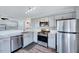 Renovated kitchen featuring stainless steel appliances, granite countertops and updated lighting at 4114 Sudbury Rd, Durham, NC 27704