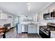 Open kitchen featuring stainless steel appliances, granite countertops and an eat-in area at 4114 Sudbury Rd, Durham, NC 27704