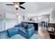 Open-concept living area with a spacious couch, seamless transition to the kitchen, and modern decor at 4114 Sudbury Rd, Durham, NC 27704